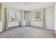 Bright bedroom featuring two large windows, and built-in shelving at 534 E 7Th Ave # 107, Denver, CO 80203