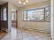 Bright dining area featuring large windows for plenty of natural light at 534 E 7Th Ave # 107, Denver, CO 80203