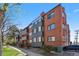Brick condominium building featuring modern architectural elements and inviting balconies at 534 E 7Th Ave # 107, Denver, CO 80203