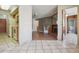 Cozy living room featuring a fireplace, wood floors, and natural light; view into the kitchen at 534 E 7Th Ave # 107, Denver, CO 80203