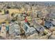 Aerial view of a house with a gray roof, a fenced backyard, and mature landscaping in a residential neighborhood at 5920 S Bemis St, Littleton, CO 80120