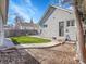 Backyard with artificial turf and a black door at 5920 S Bemis St, Littleton, CO 80120