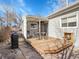 This backyard has a patio that features outdoor furniture and a built-in grill at 5920 S Bemis St, Littleton, CO 80120