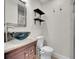 Bathroom with a stylish sink, sleek shelving, and modern fixtures at 5920 S Bemis St, Littleton, CO 80120