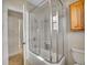 Modern bathroom with tiled shower and glass enclosure at 5920 S Bemis St, Littleton, CO 80120