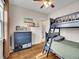 Charming bedroom featuring a cozy bunk bed and a stylish dresser with book shelves at 5920 S Bemis St, Littleton, CO 80120