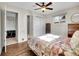 This bedroom features a ceiling fan and a colorful quilt on the bed at 5920 S Bemis St, Littleton, CO 80120