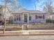 Charming home with landscaped front yard and black iron fence at 5920 S Bemis St, Littleton, CO 80120