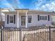 Attractive single-story home with fenced front yard and covered entry at 5920 S Bemis St, Littleton, CO 80120