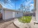 Detached garage with manicured artificial turf at 5920 S Bemis St, Littleton, CO 80120