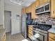 Kitchen area with stainless steel appliances and cabinets at 5920 S Bemis St, Littleton, CO 80120