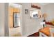 View of the kitchen with stainless steel appliances and wood cabinets from the dining room at 5920 S Bemis St, Littleton, CO 80120