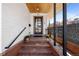 Charming front porch with brick steps and a decorative railing at 1922 E 18Th Ave, Denver, CO 80206