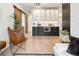Open living area with stylish sliding door, modern cabinetry, and a comfortable chair at 1922 E 18Th Ave, Denver, CO 80206