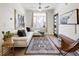 Bright living room featuring a comfortable white sectional sofa and stylish rug at 1922 E 18Th Ave, Denver, CO 80206