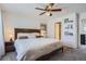 Bright bedroom with white walls, and a view into an ensuite bathroom and closet at 11832 Zenobia Loop, Westminster, CO 80031