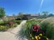Inviting exterior with a lush garden, well-maintained landscaping, and a welcoming walkway at 11832 Zenobia Loop, Westminster, CO 80031