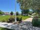 Scenic neighborhood with manicured lawns, mature trees, and colorful flower beds along sidewalks at 11832 Zenobia Loop, Westminster, CO 80031