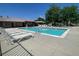Community pool with lounge chairs, umbrellas, and a spacious deck perfect for relaxing on sunny days at 11832 Zenobia Loop, Westminster, CO 80031