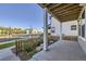 Covered back patio with concrete flooring, white support beams and view of the neighborhood at 128 E Douglas St, Superior, CO 80027