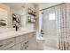 Modern bathroom with sleek fixtures, quartz countertop, walk-in shower, and elegant design at 128 E Douglas St, Superior, CO 80027
