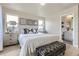 Bright bedroom boasts a large bed, modern furnishings, and plenty of natural light from multiple windows at 128 E Douglas St, Superior, CO 80027