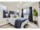Serene bedroom with modern decor, ample natural light, stylish accents, and a relaxing atmosphere at 128 E Douglas St, Superior, CO 80027