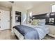 Cozy bedroom featuring contemporary headboard, soft lighting, and serene ambiance at 128 E Douglas St, Superior, CO 80027