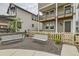 Inviting front exterior featuring a quaint picket fence and patio benches at 128 E Douglas St, Superior, CO 80027