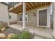 Inviting front entrance with a covered porch, featuring a welcoming walkway and lush landscaping at 128 E Douglas St, Superior, CO 80027