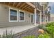 A covered front porch perfect for relaxing, with easy access to the front door and garden at 128 E Douglas St, Superior, CO 80027