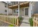 Charming front porch with a welcoming entrance, and a beautiful garden at 128 E Douglas St, Superior, CO 80027