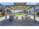 The gazebo offers a shaded area with tables and benches overlooking a well-maintained community green space at 128 E Douglas St, Superior, CO 80027