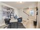 Stylish home office featuring modern desk, black chairs, and contemporary artwork at 128 E Douglas St, Superior, CO 80027