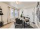 Bright home office with natural light, modern desk, and black accent chair at 128 E Douglas St, Superior, CO 80027