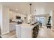 Modern kitchen has a large center island, stainless appliances, and a dining area with natural light at 128 E Douglas St, Superior, CO 80027