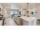 Open concept kitchen with large island, stainless steel appliances, and modern lighting at 128 E Douglas St, Superior, CO 80027