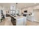 Bright kitchen with large island, quartz countertops, stainless appliances, and open-concept to the living area at 128 E Douglas St, Superior, CO 80027