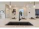 Kitchen island sink features modern faucet and stylish pendant lighting and decor at 128 E Douglas St, Superior, CO 80027