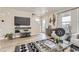 Well-lit living area showcases modern decor, comfortable seating, and stylish entertainment center at 128 E Douglas St, Superior, CO 80027