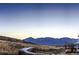 Scenic mountain view with a winding road leading to a beautiful horizon at 128 E Douglas St, Superior, CO 80027