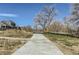 Picturesque walking path offers a scenic route lined with trees and views of the community homes at 128 E Douglas St, Superior, CO 80027