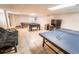 Finished basement recreation room with a pool table, foosball table, ping pong table, and tv for entertainment at 6118 Salvia Ct, Arvada, CO 80403