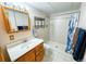 Bathroom features a walk-in shower and a vanity with ample storage at 6118 Salvia Ct, Arvada, CO 80403