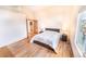 Bright main bedroom with hardwood floors and natural light at 6118 Salvia Ct, Arvada, CO 80403