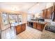 Open kitchen with island, breakfast bar, and modern appliances at 6118 Salvia Ct, Arvada, CO 80403