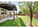 Well-maintained backyard with a pergola-covered patio and a lush lawn, perfect for outdoor enjoyment and gatherings at 9481 Longstone Dr, Parker, CO 80134