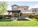 Fenced backyard with patio and covered pergola at 9481 Longstone Dr, Parker, CO 80134