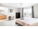 Bright bedroom with large window, ceiling fan, and en-suite bathroom at 9481 Longstone Dr, Parker, CO 80134