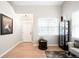 Bright entryway with hardwood floors, white door, and ample natural light at 9481 Longstone Dr, Parker, CO 80134